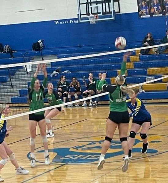 Byers sets it over on another Byers Volleyball player