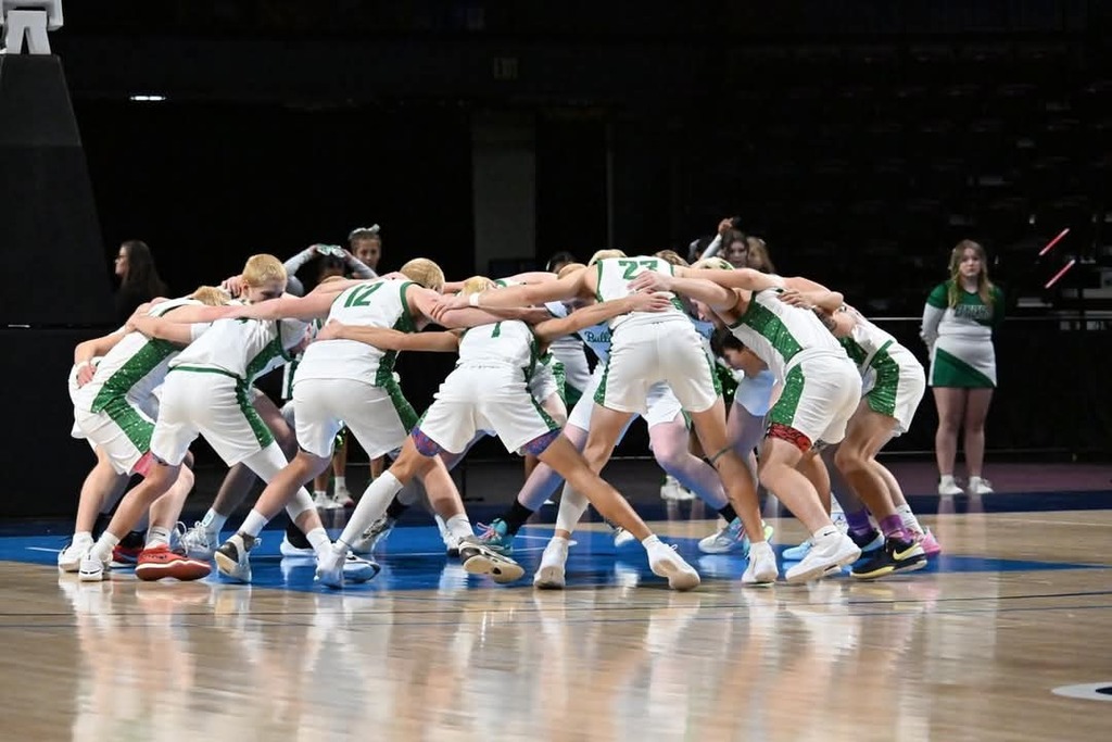 the team in the Huddle at state