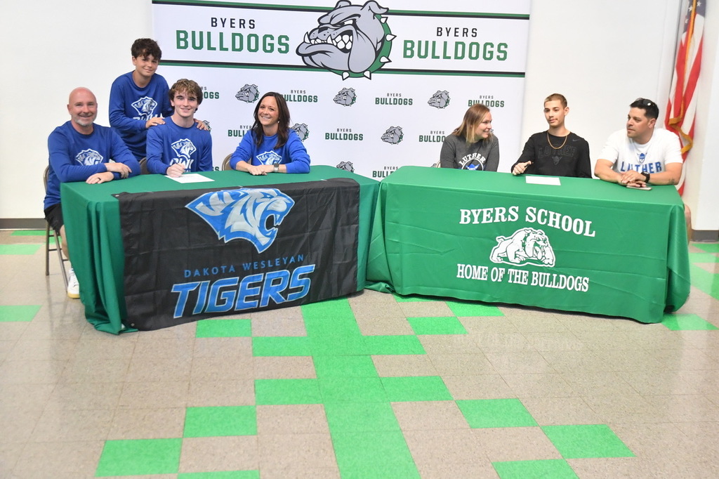 both boys sitting letters of intent
