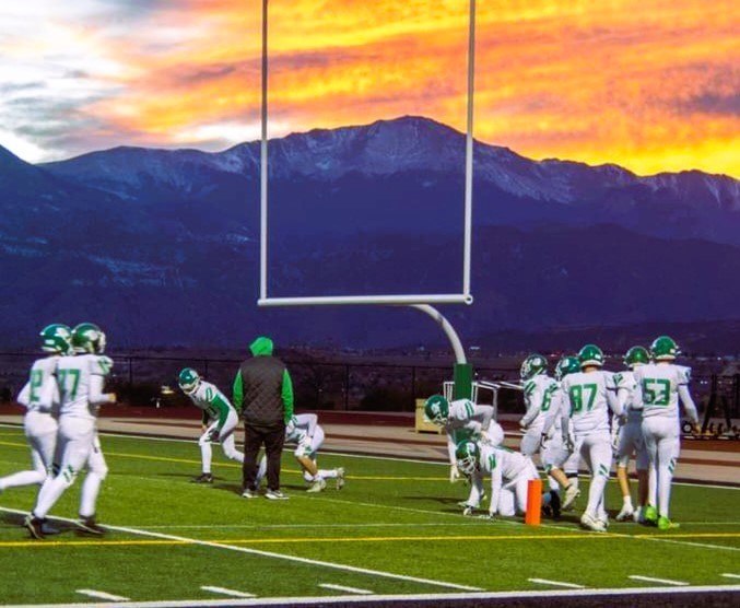 Byers Football with Mountains and sunset