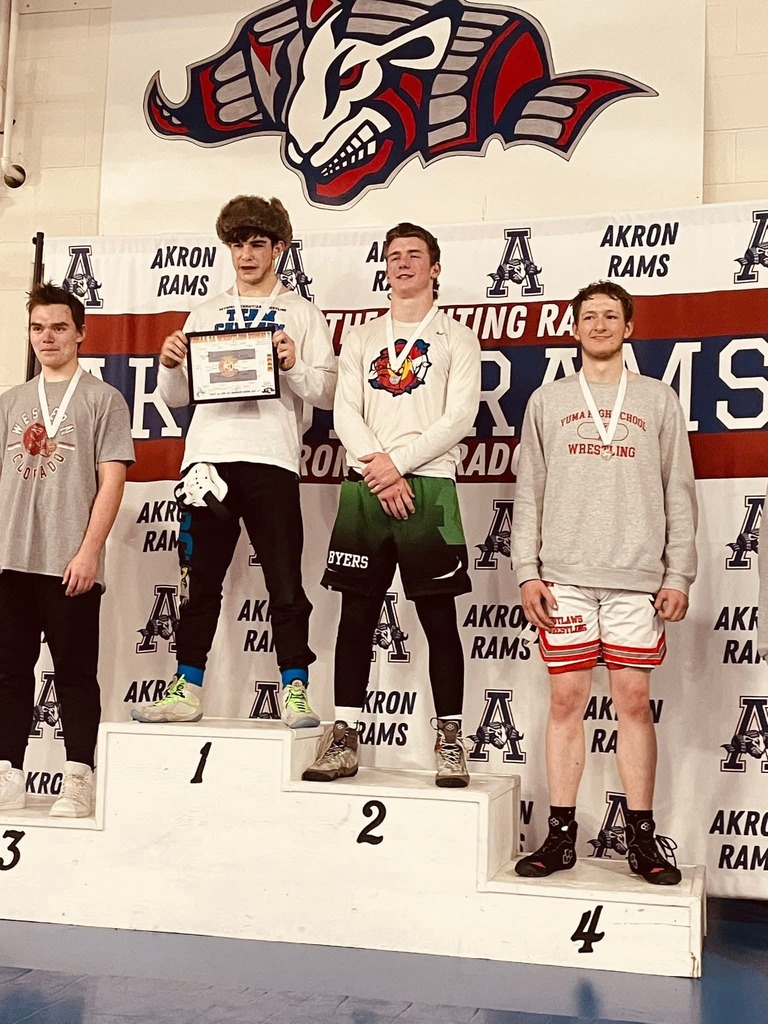 wes on the podium at Reginal wrestling 