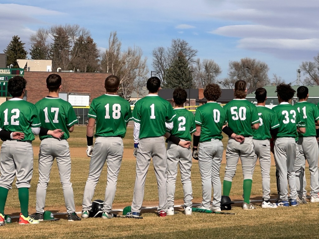baseball standing for the anthem. 