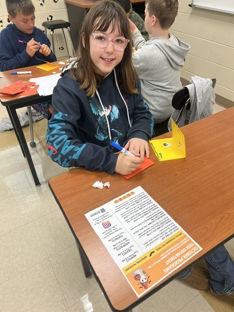 Pictures of Builders Club making cards to be given to children who are in the hospital.
