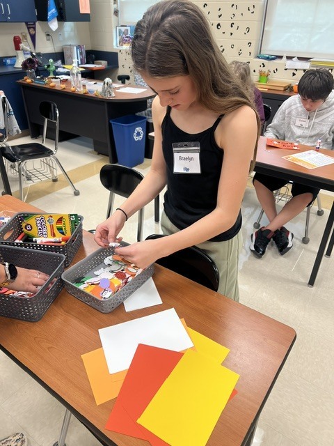 Pictures of Builders Club making cards to be given to children who are in the hospital.