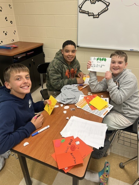 Pictures of Builders Club making cards to be given to children who are in the hospital.