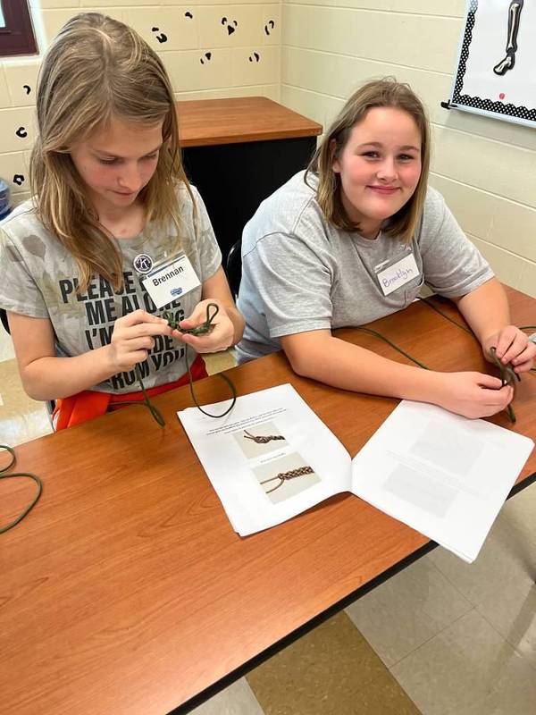 Students learning how to make a paracord