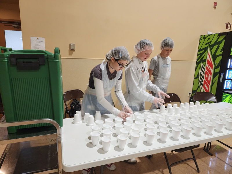 Students setting up drink cups