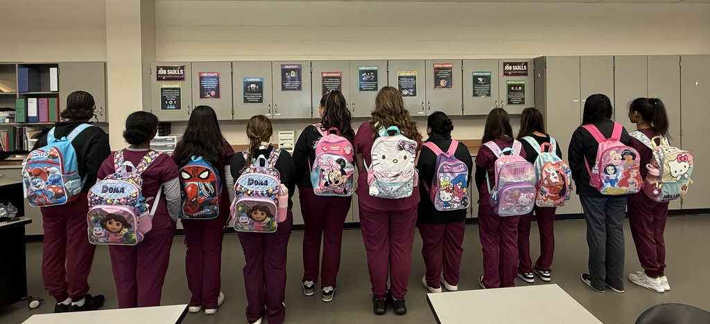 MA students and backpacks