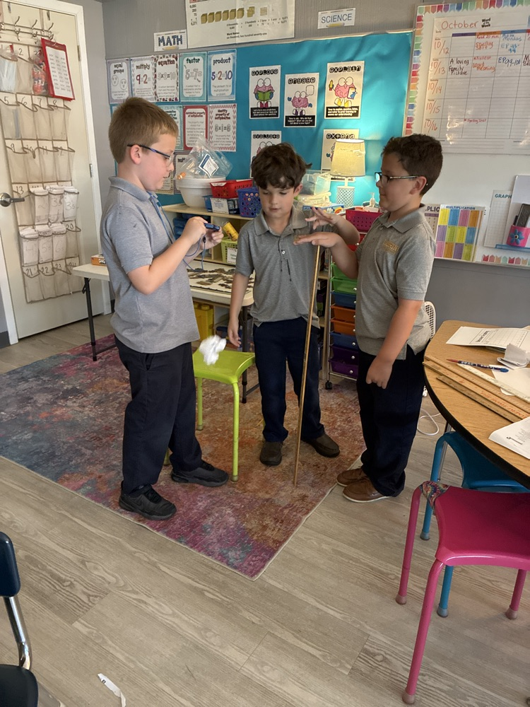 Mrs D’s third grade scientist testing the motion of a piece of paper.