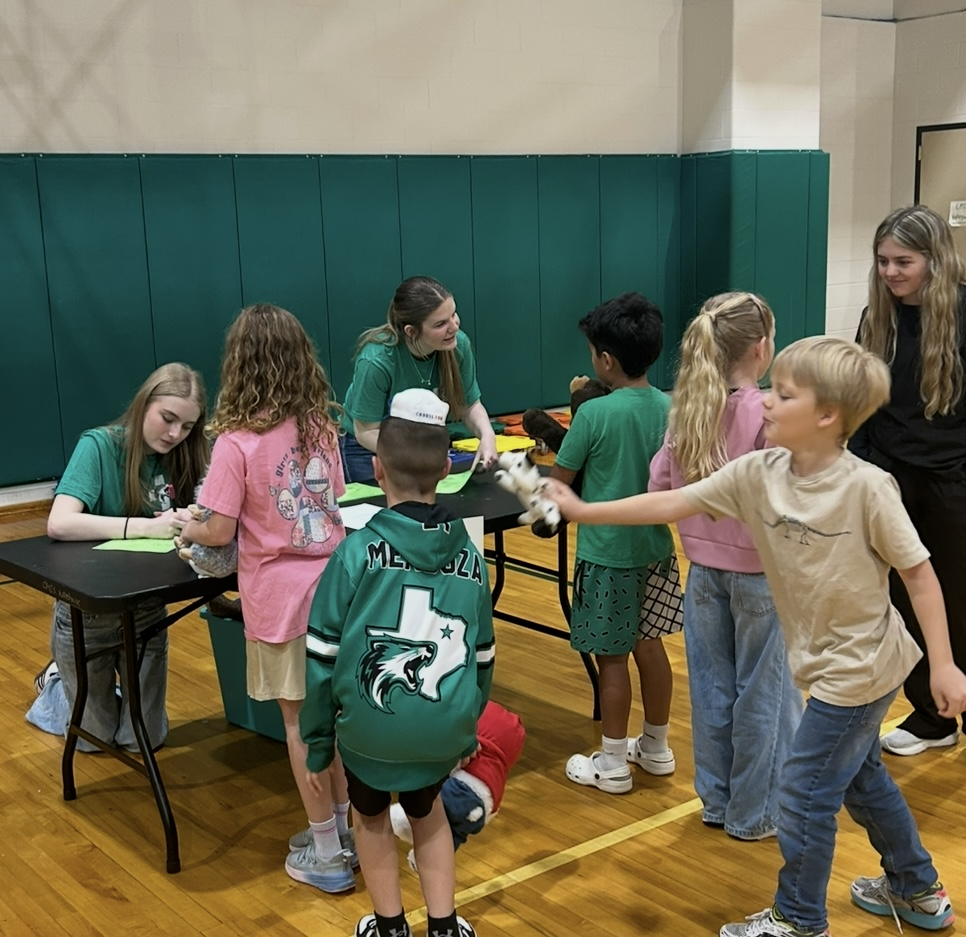 HOSA students hosting a Teddy Bear Clinic