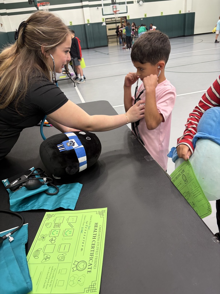 HOSA students hosting a Teddy Bear Clinic