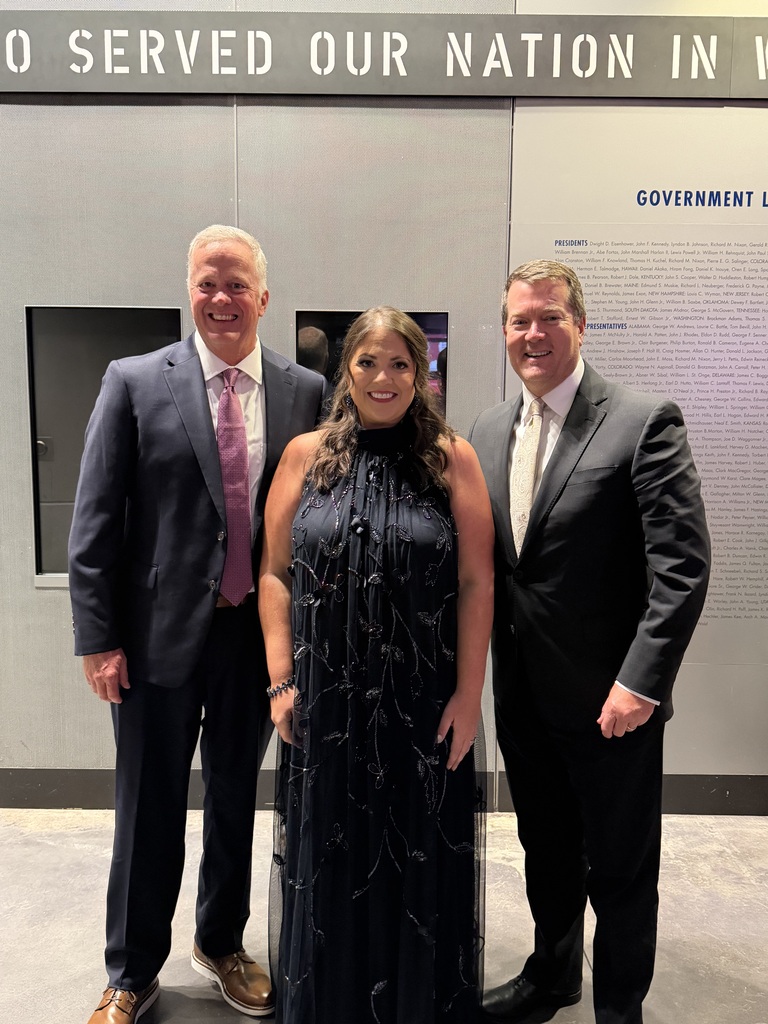 Shannon Wall, Monica Speyrer, and Superintendent Keith Burton pose for a photo