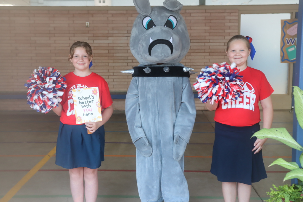Two cheerleaders and a bulldog-costumed mascot