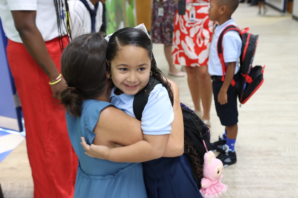 Two students hugging on the first day of school
