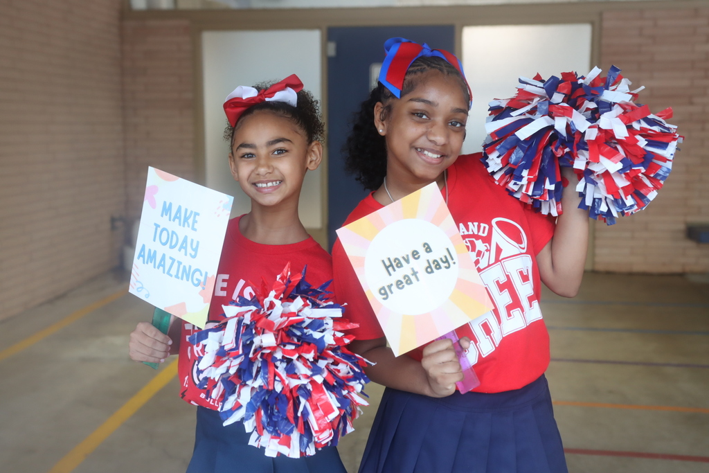 Two smiling cheerleaders on the first day of school