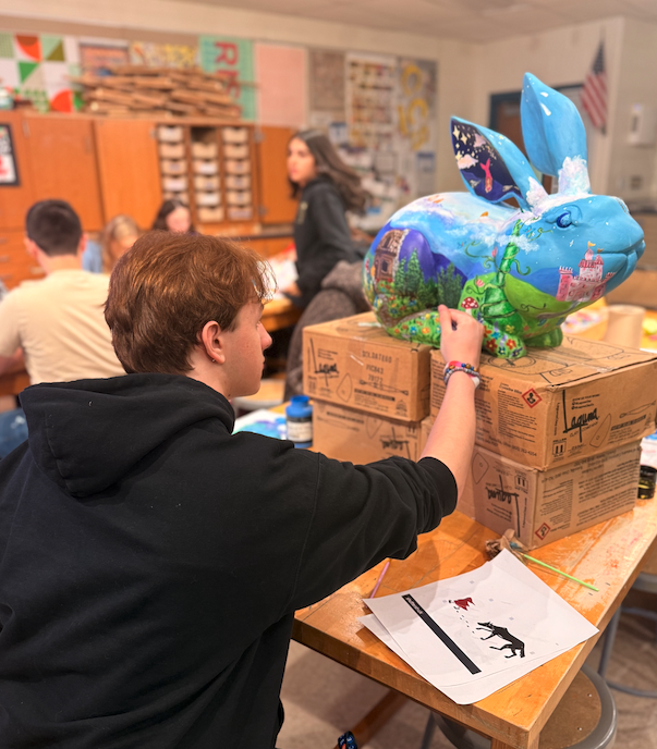 NAHS student painting "Once Upon a Time" sculpture