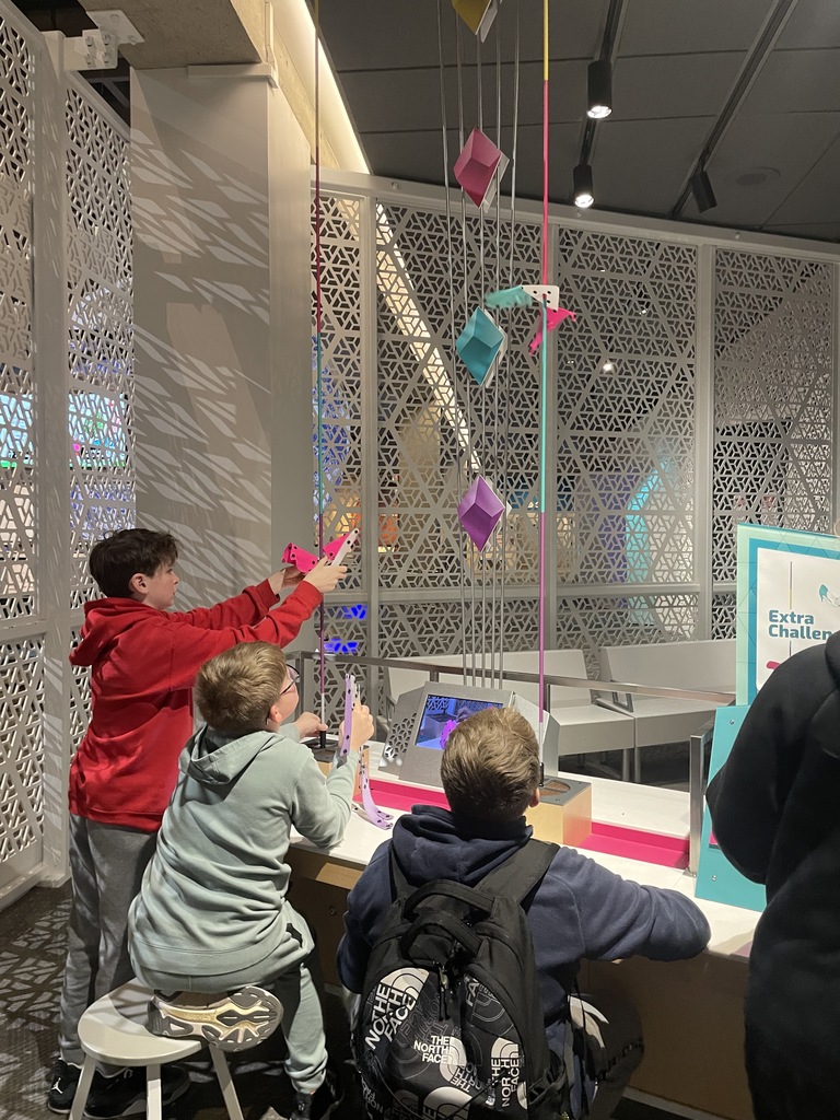 Students pictured with an interactive feature