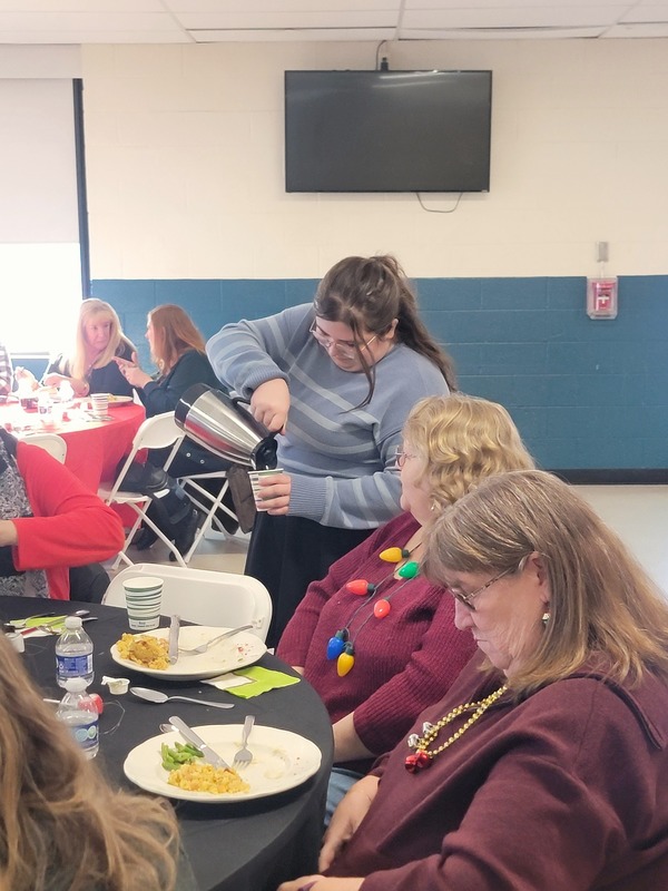 student pouring coffee