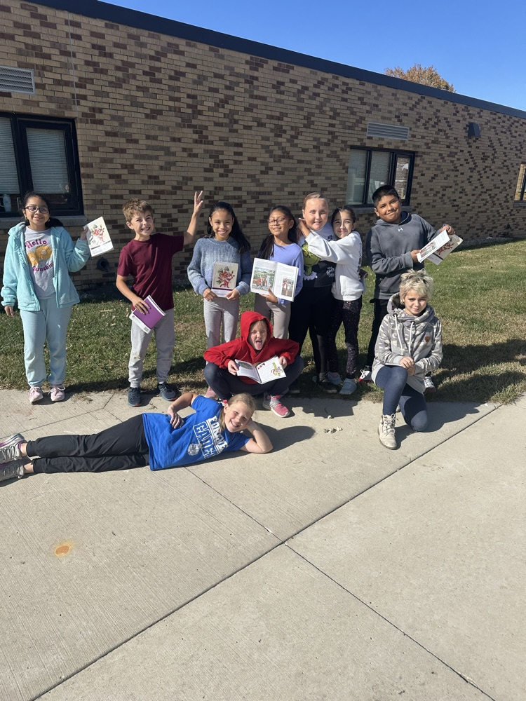 5th graders reading outside today!
