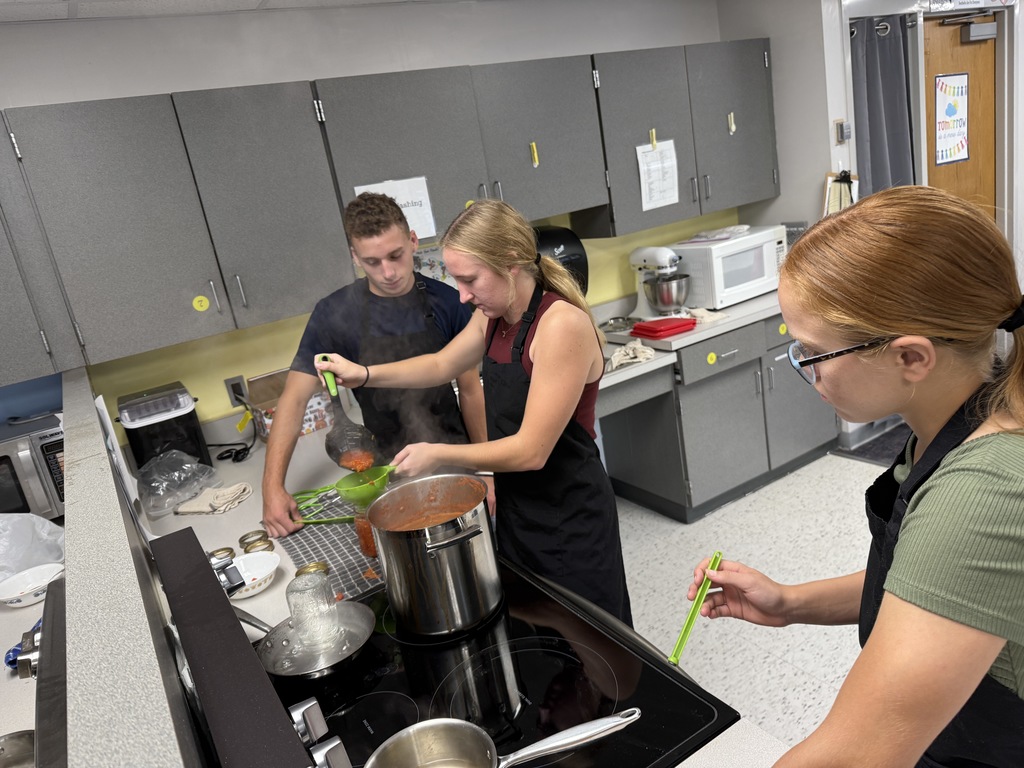 students canning tomatoes in FCS class