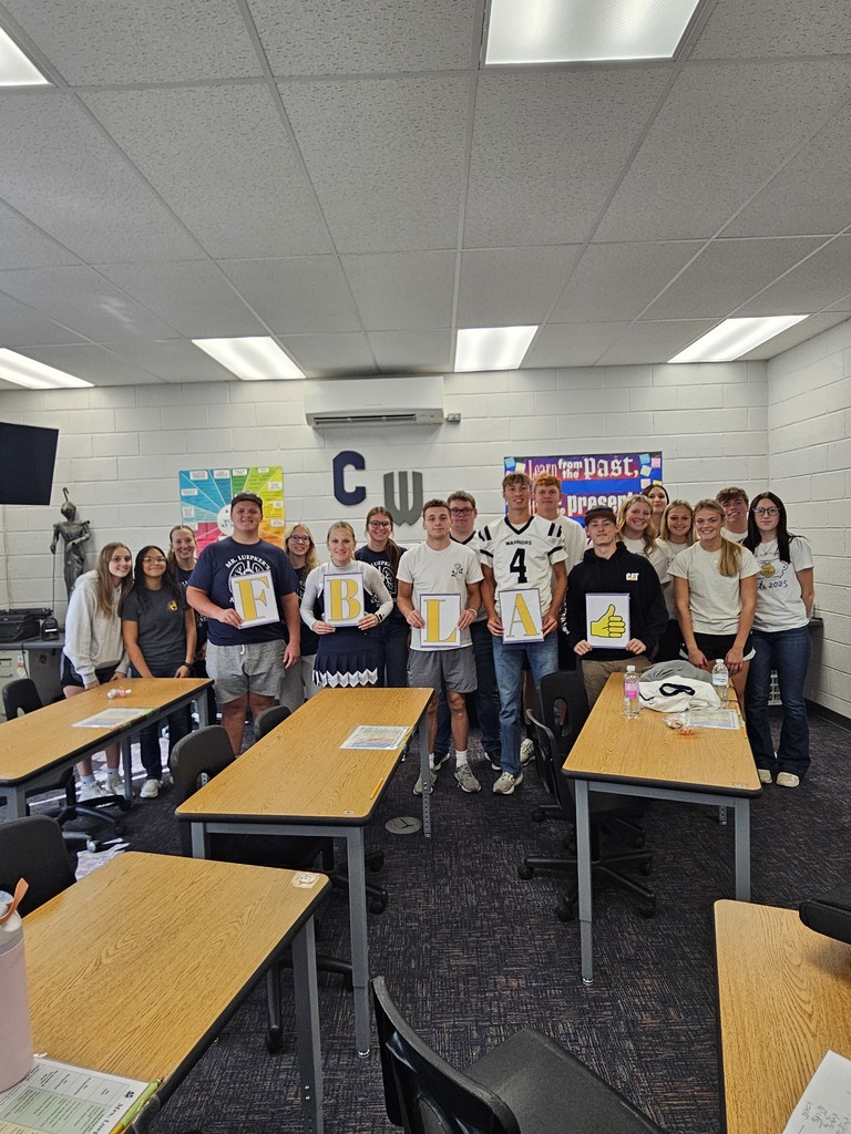 FBLA students with sign