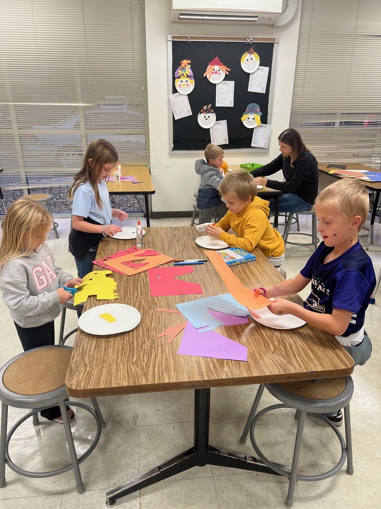 Students are making scarecrows with families- Literacy Night 