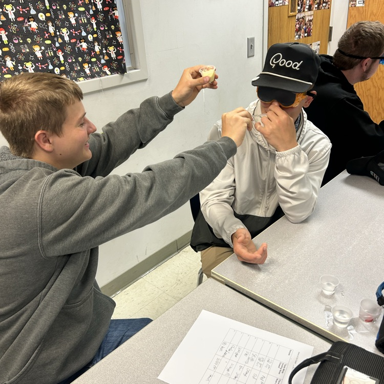 student feeding student 