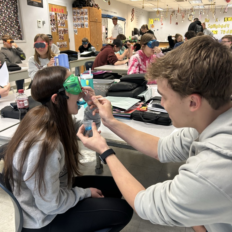 student feeding student 