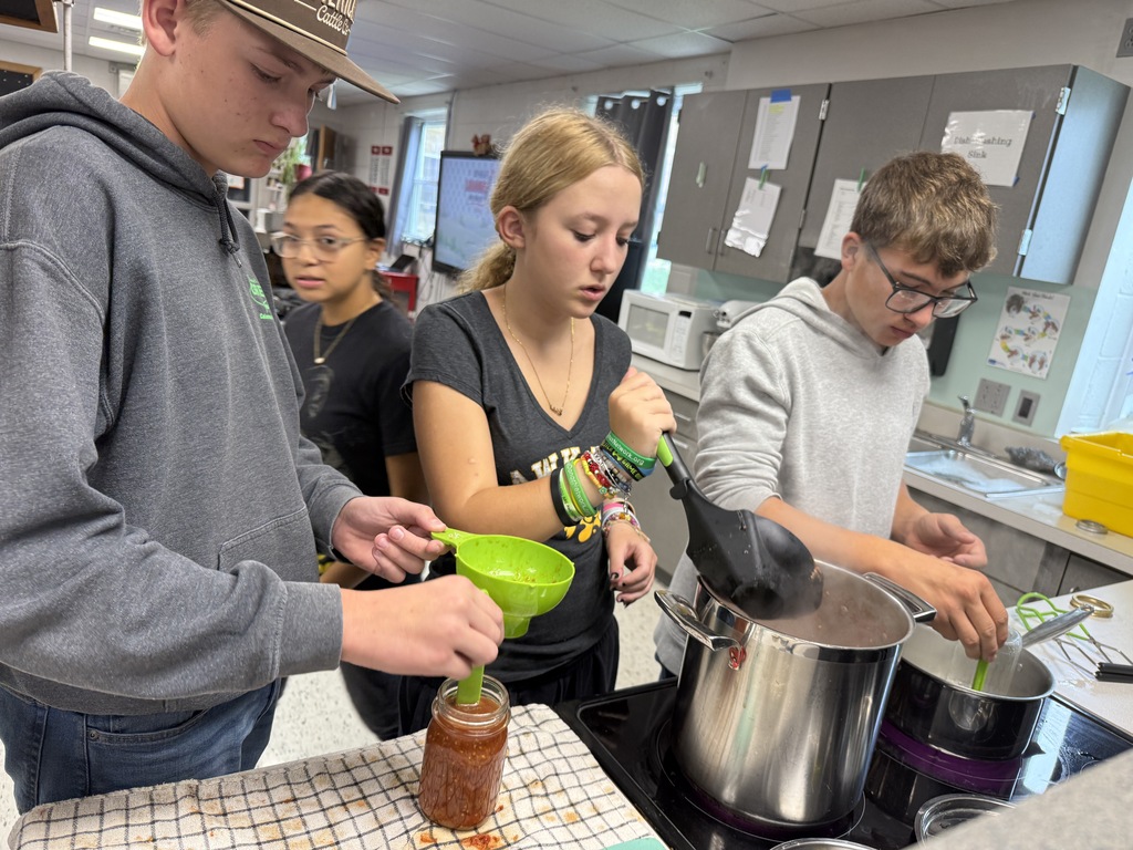 students canning tomatoes