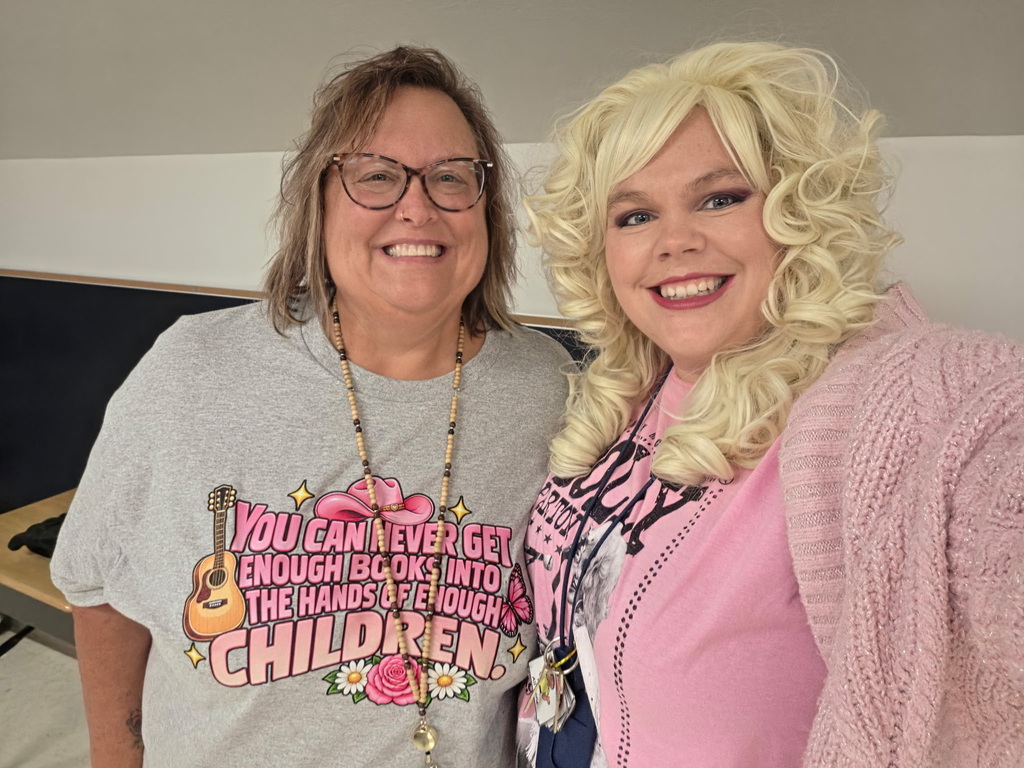 Two teachers dressed up like Dolly