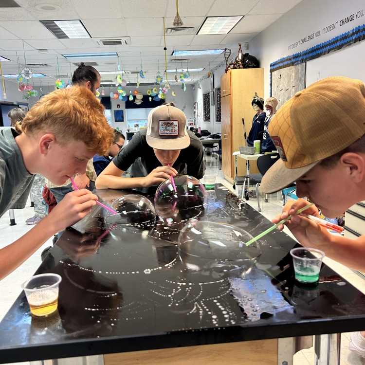student blowing bubbles