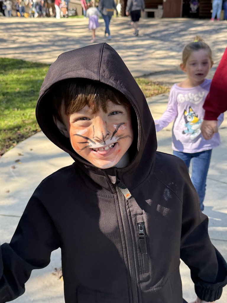 student with tiger face paint