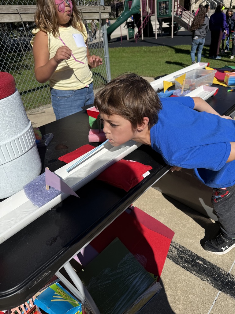 Student racing boats with water