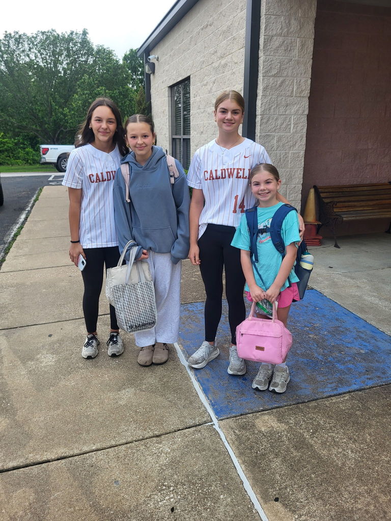 Serving smiles this morning… bringing the heat tomorrow 🔥  Our Lady Hornets kicked off the day at CIS opening car doors and greeting students—because that’s what it means to be a Hornet.  Next stop: PLAYOFFS. 🥎 Round 1 starts tomorrow—let’s go!! #CaldwellProud #CaldwellISD