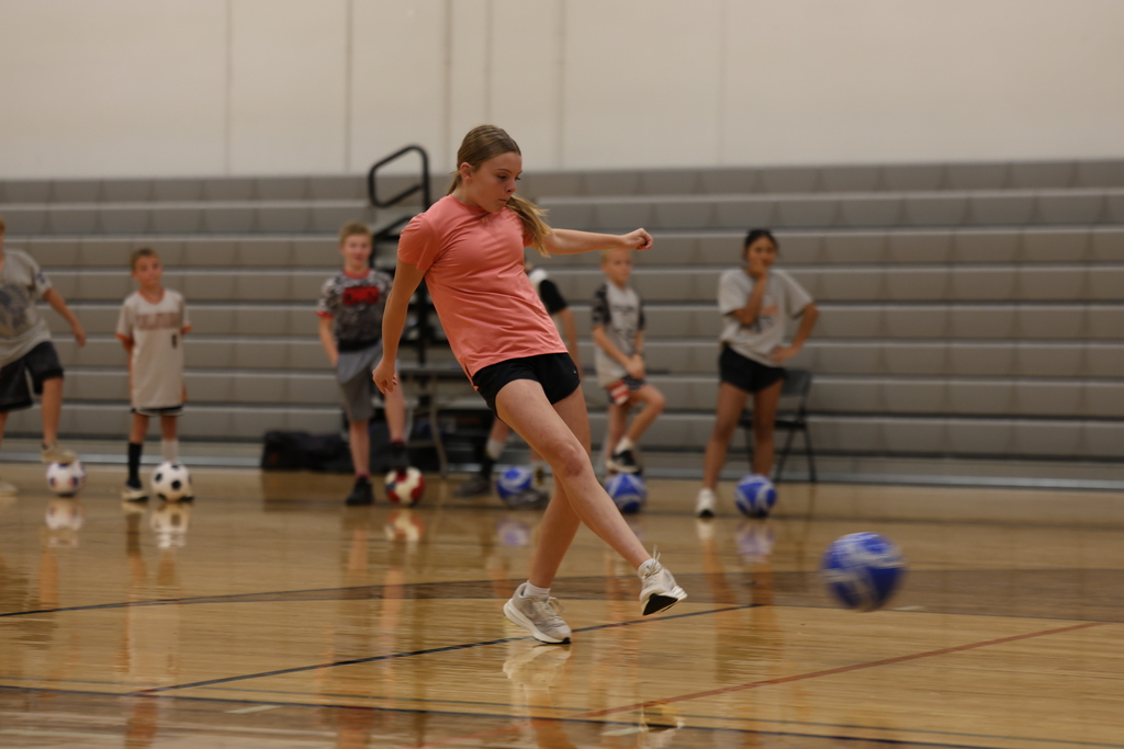 Option 3  ⚽️ Another great day at Soccer Camp!  From learning new skills to building confidence and teamwork, our campers have been putting in the work and having fun doing it. We can't wait to finish the week strong today! 🧡🖤 #StingEm