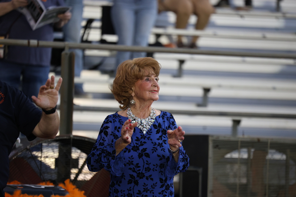 🧡 𝗢𝗡𝗖𝗘 𝗔 𝗛𝗢𝗥𝗡𝗘𝗧, 𝗔𝗟𝗪𝗔𝗬𝗦 𝗔 𝗛𝗢𝗥𝗡𝗘𝗧. 🧡  Friday night’s Homecoming was made extra special by a very special guest — 𝗦𝘁𝗲𝗽𝗵𝗶𝗻𝗮 (𝗡𝗮𝘃𝗿𝗮𝘁𝗶𝗹) 𝗗𝗶𝗗𝗼𝗻𝗮𝘁𝗼, Caldwell High School Class of 1951.  At 94 years young, Stephina traveled all the way from Delaware to come home to Caldwell. She spent the day touring CHS and visiting band rehearsal before making the most of Friday night under the lights.  Under the Friday night lights, she 𝗰𝗼𝗻𝗱𝘂𝗰𝘁𝗲𝗱 𝘁𝗵𝗲 𝗛𝗼𝗿𝗻𝗲𝘁 𝗕𝗮𝗻𝗱 𝗶𝗻 𝘁𝗵𝗲 𝘀𝗰𝗵𝗼𝗼𝗹 𝗮𝗹𝗺𝗮 𝗺𝗮𝘁𝗲𝗿, 𝗽𝗿𝗼𝘂𝗱𝗹𝘆 𝗙𝗟𝗜𝗣𝗣𝗘𝗗 𝘁𝗵𝗲 𝗰𝗼𝗶𝗻 𝗳𝗼𝗿 𝘁𝗵𝗲 𝗼𝗽𝗲𝗻𝗶𝗻𝗴 𝘁𝗼𝘀𝘀, 𝗮𝗻𝗱 𝗵𝗲𝗹𝗽𝗲𝗱 𝗰𝗿𝗼𝘄𝗻 𝗼𝘂𝗿 𝟮𝟬𝟮𝟲 𝗛𝗼𝗺𝗲𝗰𝗼𝗺𝗶𝗻𝗴 𝗤𝘂𝗲𝗲𝗻.   Seventy-five years after graduating from CHS, Stephina reminded us that the years may pass and generations may change, but 𝒚𝙤𝒖 𝒏𝙚𝒗𝙚𝒓 𝒓𝙚𝒂𝙡𝒍𝙮 𝙨𝒕𝙤𝒑 𝒃𝙚𝒊𝙣𝒈 𝒂 𝑯𝙤𝒓𝙣𝒆𝙩.  Thank you for coming home, Stephina. 𝗧𝗵𝗶𝘀 𝗶𝘀 𝗼𝗻𝗲 𝗛𝗼𝗺𝗲𝗰𝗼𝗺𝗶𝗻𝗴 𝘄𝗲 𝘄𝗼𝗻’𝘁 𝘀𝗼𝗼𝗻 𝗳𝗼𝗿𝗴𝗲𝘁. #CaldwellProud #CaldwellISD
