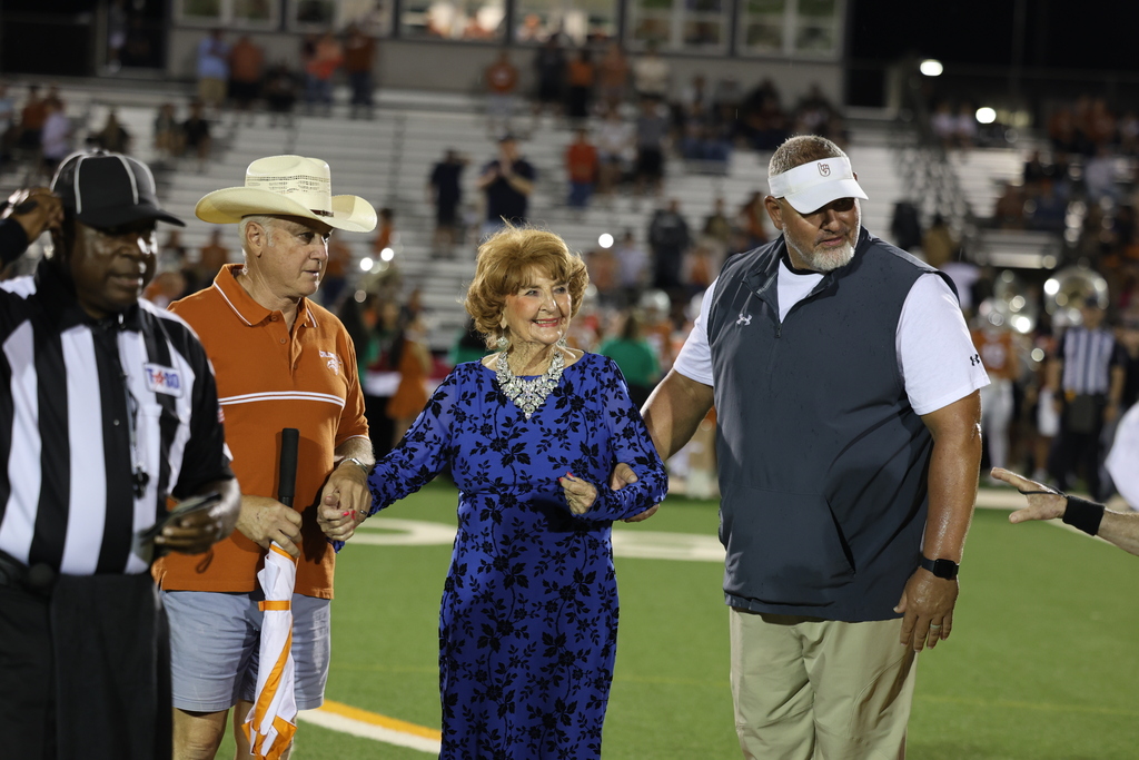 🧡 𝗢𝗡𝗖𝗘 𝗔 𝗛𝗢𝗥𝗡𝗘𝗧, 𝗔𝗟𝗪𝗔𝗬𝗦 𝗔 𝗛𝗢𝗥𝗡𝗘𝗧. 🧡  Friday night’s Homecoming was made extra special by a very special guest — 𝗦𝘁𝗲𝗽𝗵𝗶𝗻𝗮 (𝗡𝗮𝘃𝗿𝗮𝘁𝗶𝗹) 𝗗𝗶𝗗𝗼𝗻𝗮𝘁𝗼, Caldwell High School Class of 1951.  At 94 years young, Stephina traveled all the way from Delaware to come home to Caldwell. She spent the day touring CHS and visiting band rehearsal before making the most of Friday night under the lights.  Under the Friday night lights, she 𝗰𝗼𝗻𝗱𝘂𝗰𝘁𝗲𝗱 𝘁𝗵𝗲 𝗛𝗼𝗿𝗻𝗲𝘁 𝗕𝗮𝗻𝗱 𝗶𝗻 𝘁𝗵𝗲 𝘀𝗰𝗵𝗼𝗼𝗹 𝗮𝗹𝗺𝗮 𝗺𝗮𝘁𝗲𝗿, 𝗽𝗿𝗼𝘂𝗱𝗹𝘆 𝗙𝗟𝗜𝗣𝗣𝗘𝗗 𝘁𝗵𝗲 𝗰𝗼𝗶𝗻 𝗳𝗼𝗿 𝘁𝗵𝗲 𝗼𝗽𝗲𝗻𝗶𝗻𝗴 𝘁𝗼𝘀𝘀, 𝗮𝗻𝗱 𝗵𝗲𝗹𝗽𝗲𝗱 𝗰𝗿𝗼𝘄𝗻 𝗼𝘂𝗿 𝟮𝟬𝟮𝟲 𝗛𝗼𝗺𝗲𝗰𝗼𝗺𝗶𝗻𝗴 𝗤𝘂𝗲𝗲𝗻.   Seventy-five years after graduating from CHS, Stephina reminded us that the years may pass and generations may change, but 𝒚𝙤𝒖 𝒏𝙚𝒗𝙚𝒓 𝒓𝙚𝒂𝙡𝒍𝙮 𝙨𝒕𝙤𝒑 𝒃𝙚𝒊𝙣𝒈 𝒂 𝑯𝙤𝒓𝙣𝒆𝙩.  Thank you for coming home, Stephina. 𝗧𝗵𝗶𝘀 𝗶𝘀 𝗼𝗻𝗲 𝗛𝗼𝗺𝗲𝗰𝗼𝗺𝗶𝗻𝗴 𝘄𝗲 𝘄𝗼𝗻’𝘁 𝘀𝗼𝗼𝗻 𝗳𝗼𝗿𝗴𝗲𝘁. #CaldwellProud #CaldwellISD
