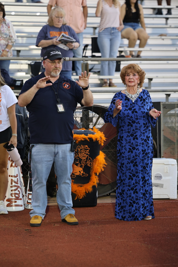 🧡 𝗢𝗡𝗖𝗘 𝗔 𝗛𝗢𝗥𝗡𝗘𝗧, 𝗔𝗟𝗪𝗔𝗬𝗦 𝗔 𝗛𝗢𝗥𝗡𝗘𝗧. 🧡  Friday night’s Homecoming was made extra special by a very special guest — 𝗦𝘁𝗲𝗽𝗵𝗶𝗻𝗮 (𝗡𝗮𝘃𝗿𝗮𝘁𝗶𝗹) 𝗗𝗶𝗗𝗼𝗻𝗮𝘁𝗼, Caldwell High School Class of 1951.  At 94 years young, Stephina traveled all the way from Delaware to come home to Caldwell. She spent the day touring CHS and visiting band rehearsal before making the most of Friday night under the lights.  Under the Friday night lights, she 𝗰𝗼𝗻𝗱𝘂𝗰𝘁𝗲𝗱 𝘁𝗵𝗲 𝗛𝗼𝗿𝗻𝗲𝘁 𝗕𝗮𝗻𝗱 𝗶𝗻 𝘁𝗵𝗲 𝘀𝗰𝗵𝗼𝗼𝗹 𝗮𝗹𝗺𝗮 𝗺𝗮𝘁𝗲𝗿, 𝗽𝗿𝗼𝘂𝗱𝗹𝘆 𝗙𝗟𝗜𝗣𝗣𝗘𝗗 𝘁𝗵𝗲 𝗰𝗼𝗶𝗻 𝗳𝗼𝗿 𝘁𝗵𝗲 𝗼𝗽𝗲𝗻𝗶𝗻𝗴 𝘁𝗼𝘀𝘀, 𝗮𝗻𝗱 𝗵𝗲𝗹𝗽𝗲𝗱 𝗰𝗿𝗼𝘄𝗻 𝗼𝘂𝗿 𝟮𝟬𝟮𝟲 𝗛𝗼𝗺𝗲𝗰𝗼𝗺𝗶𝗻𝗴 𝗤𝘂𝗲𝗲𝗻.   Seventy-five years after graduating from CHS, Stephina reminded us that the years may pass and generations may change, but 𝒚𝙤𝒖 𝒏𝙚𝒗𝙚𝒓 𝒓𝙚𝒂𝙡𝒍𝙮 𝙨𝒕𝙤𝒑 𝒃𝙚𝒊𝙣𝒈 𝒂 𝑯𝙤𝒓𝙣𝒆𝙩.  Thank you for coming home, Stephina. 𝗧𝗵𝗶𝘀 𝗶𝘀 𝗼𝗻𝗲 𝗛𝗼𝗺𝗲𝗰𝗼𝗺𝗶𝗻𝗴 𝘄𝗲 𝘄𝗼𝗻’𝘁 𝘀𝗼𝗼𝗻 𝗳𝗼𝗿𝗴𝗲𝘁. #CaldwellProud #CaldwellISD