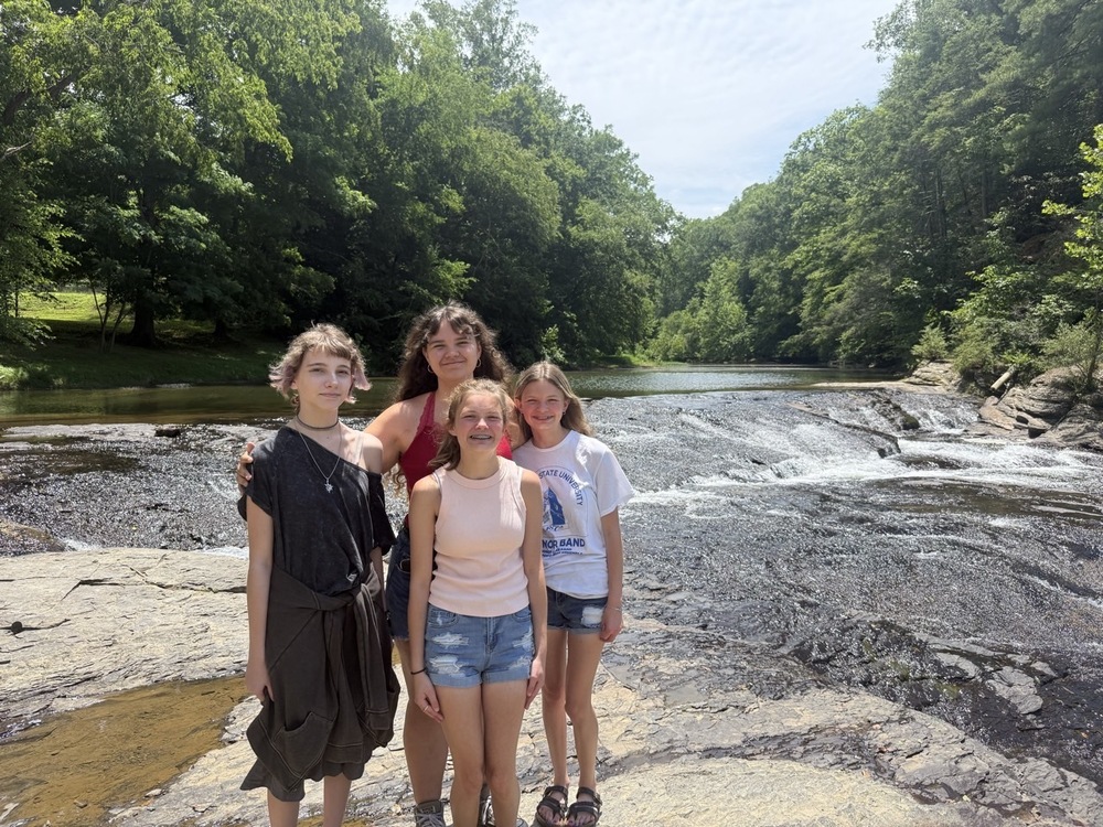 Students stand by the river as they attend the WV Wildlife Field trip