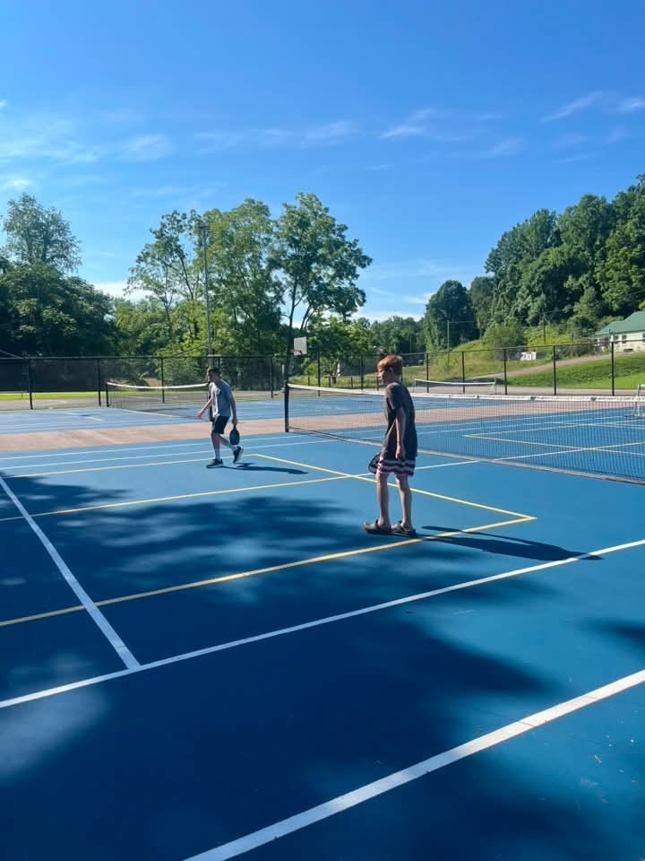 student playing pickleball