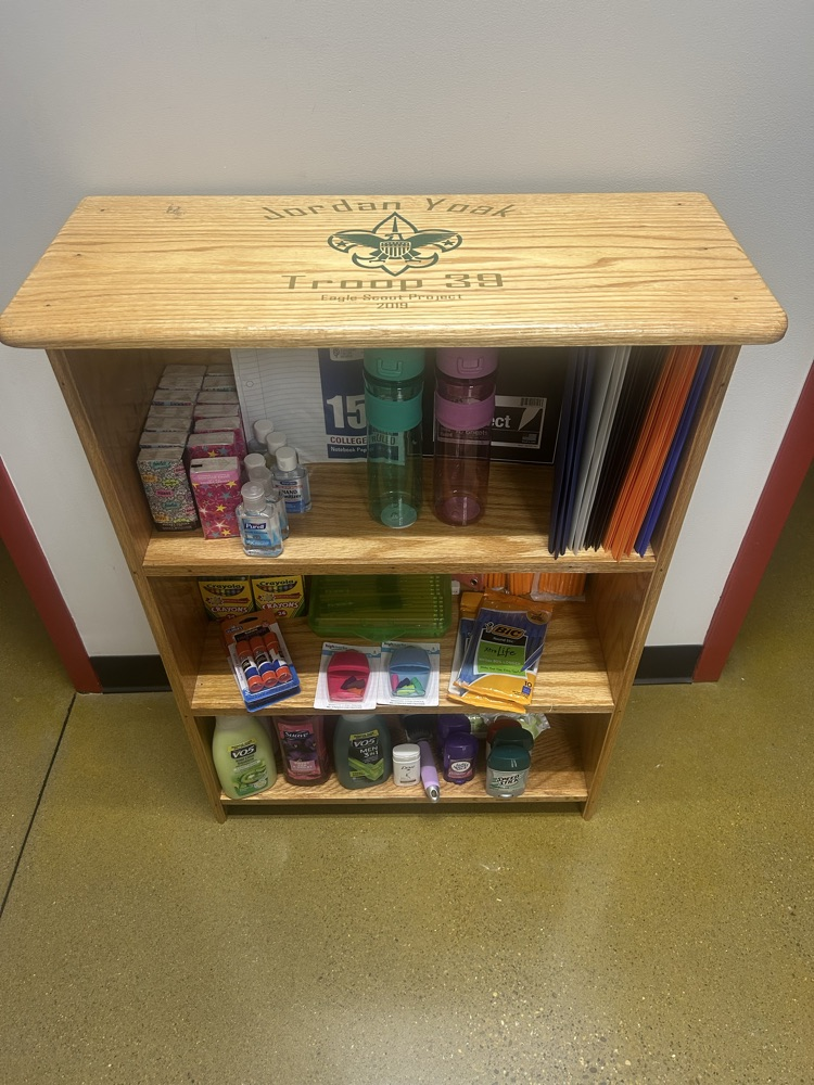 Shelves with school supplies and personal hygiene products