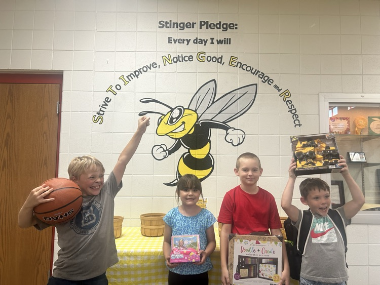 group of four students with prizes