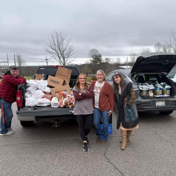 Brittany Kevin destiny and Brandi handing out food bags
