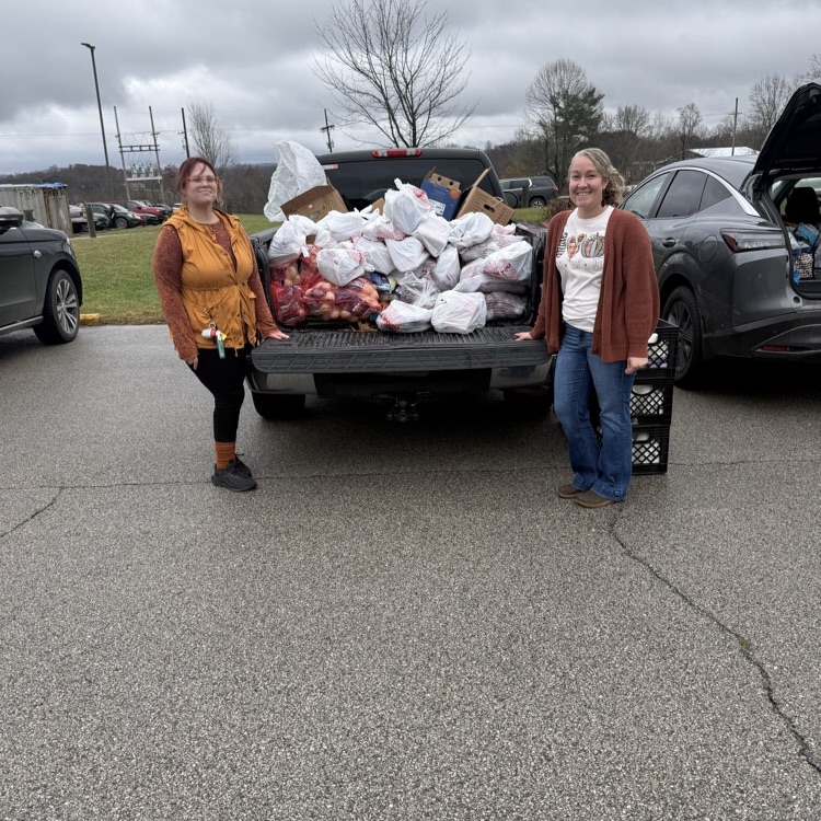 Amy and Brittany handing out food bags