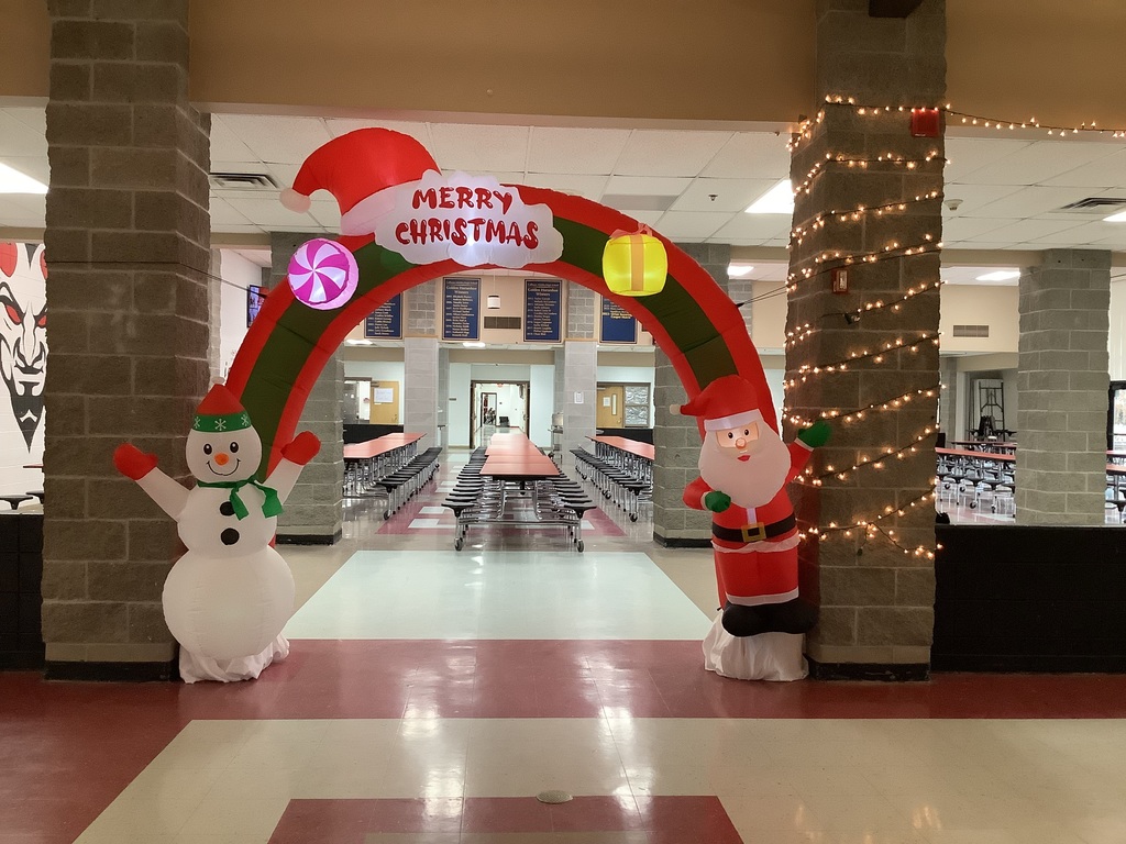 "Merry Christmas" archway with snowman and Santa.