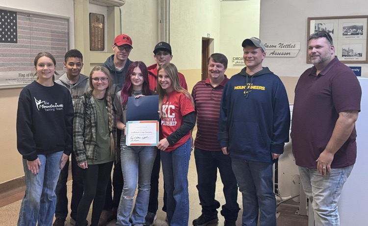 XC team with county commissioners for photo