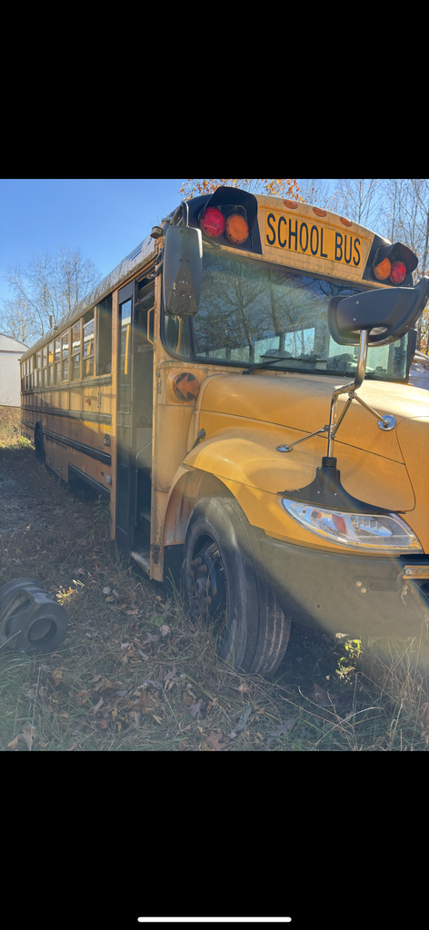 Outside view of bus 24 shows door and right front of bus