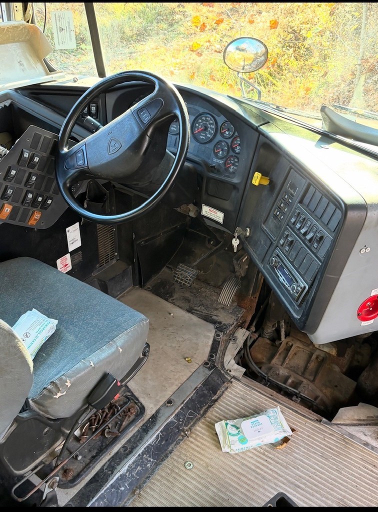 inside view of bus 39 driver's seat, steering wheel and dash