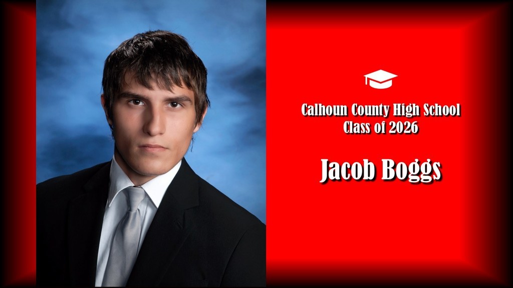 A formal senior portrait layout featuring a student wearing a black suit jacket, white shirt, and light-colored tie, posed against a blue studio background on the left. The right side displays a bright red panel with a graduation cap icon and white text reading “Calhoun County High School Class of 2026” and the name “Jacob Boggs” in large bold letters.