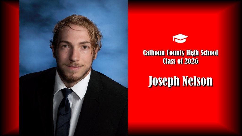 A formal senior portrait layout featuring a student with short, slightly tousled hair and light facial hair, wearing a black suit jacket, white shirt, and dark tie, posed against a blue studio background on the left. The right side displays a bright red panel with a graduation cap icon and white text that reads “Calhoun County High School Class of 2026” and the name “Joseph Nelson” in large bold letters.